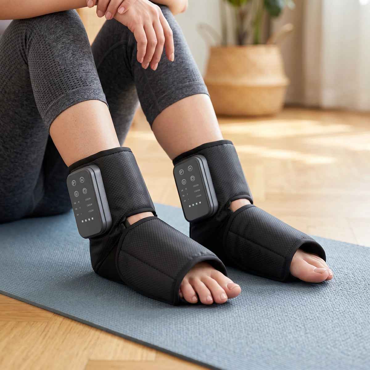 Person using Soothekin foot and ankle massager during home stretching session