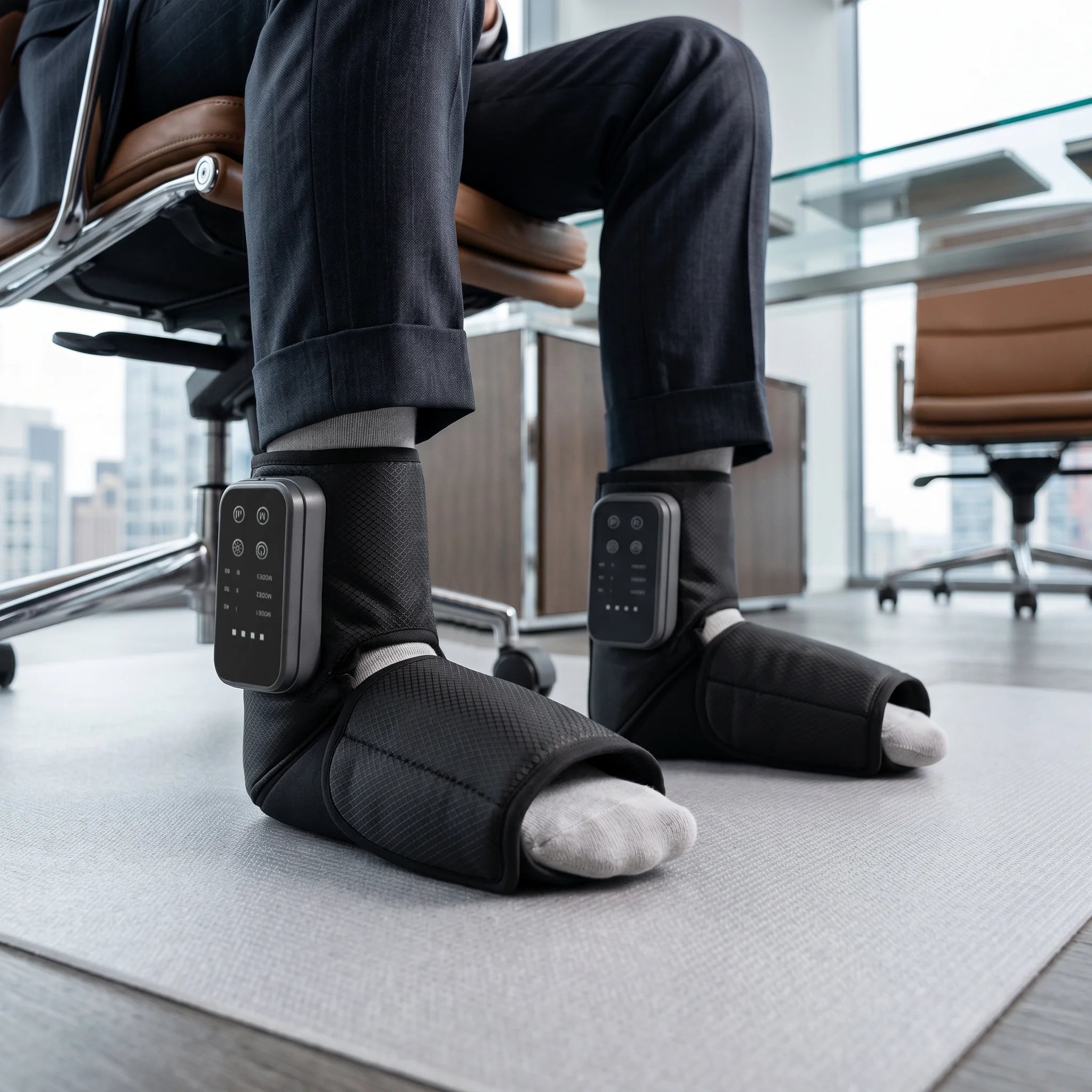 Person using Soothekin foot and ankle massager at the office