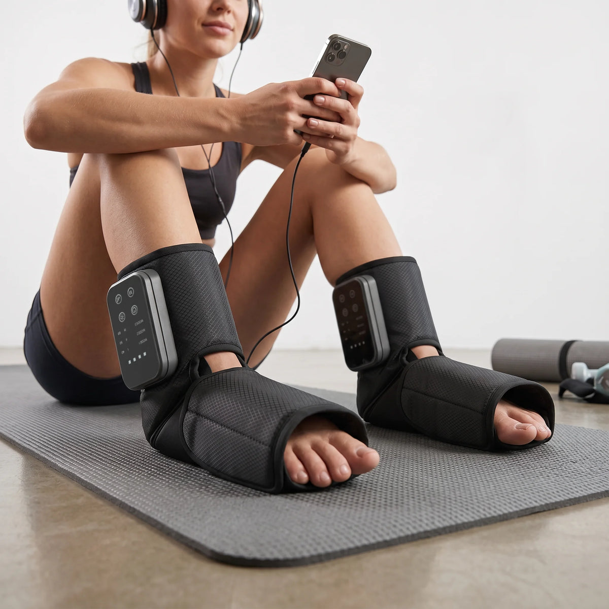 Person using Soothekin foot and ankle massager during yoga recovery